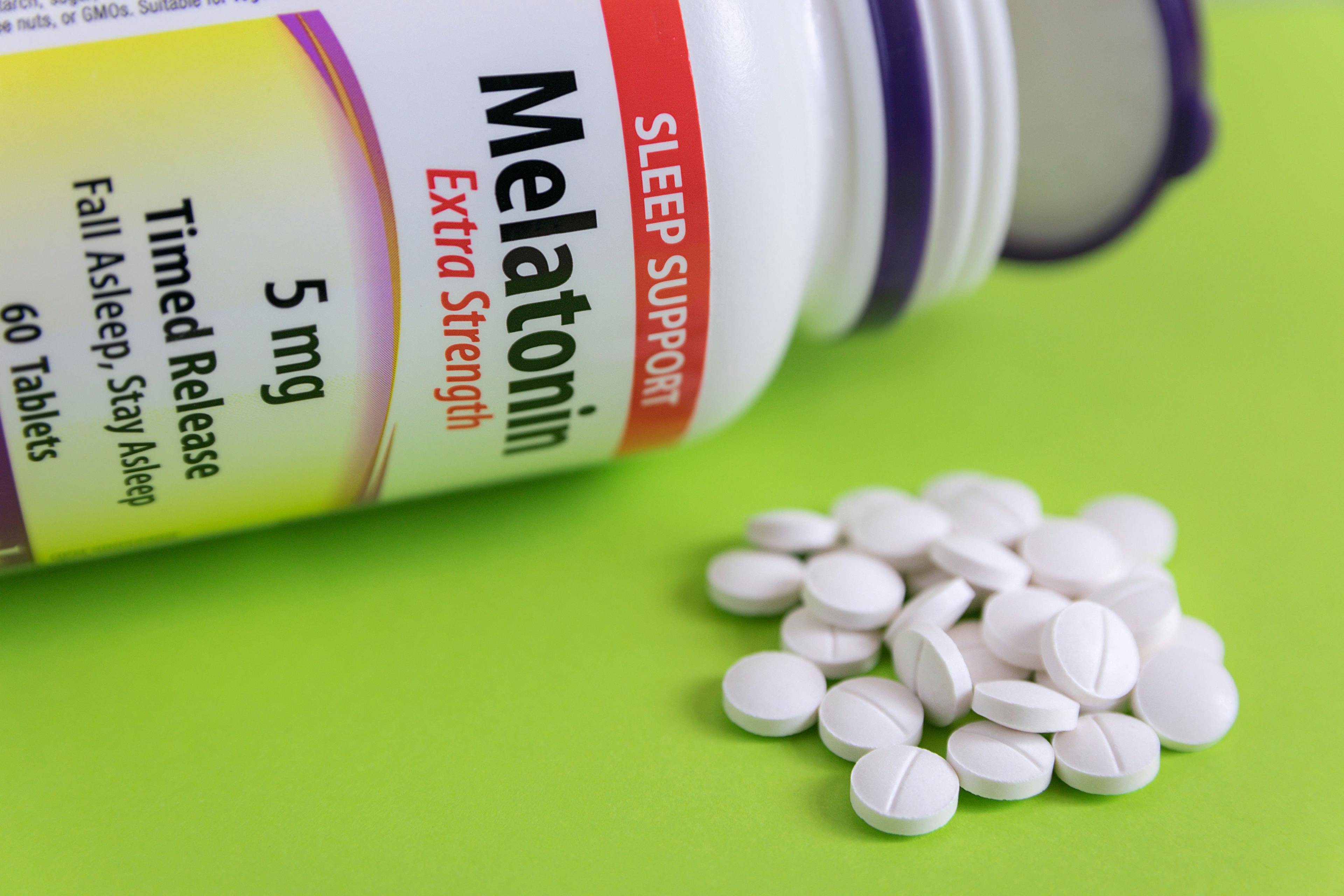 5mg melatonin pills on a green pastel surface | Image credit: Tihana - stock.adobe.com